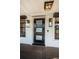 Contemporary front door featuring a sleek design and modern lighting fixtures at 3165 Renatta Dr, Belleair Bluffs, FL 33770