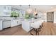 Modern kitchen boasts marble counters and backsplash, stainless appliances, a large island, and pendant lighting at 3165 Renatta Dr, Belleair Bluffs, FL 33770