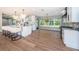 Bright, open kitchen with a large island, pendant lighting, and modern appliances offers a clean, contemporary design at 3165 Renatta Dr, Belleair Bluffs, FL 33770