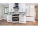 Modern kitchen with marble backsplash and counters, stainless appliances, and bright lighting at 3165 Renatta Dr, Belleair Bluffs, FL 33770