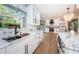 Kitchen with stainless sink and marble counter, stainless appliances, custom cabinets, and great views at 3165 Renatta Dr, Belleair Bluffs, FL 33770