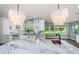 Gourmet kitchen featuring marble counters, a black faucet, and pendant lighting at 3165 Renatta Dr, Belleair Bluffs, FL 33770
