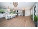 Elegant open-concept kitchen with a large island, modern appliances, and chic barstools at 3165 Renatta Dr, Belleair Bluffs, FL 33770