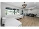 Bright living room with large windows and hardwood floors at 3165 Renatta Dr, Belleair Bluffs, FL 33770