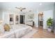 Bright main bedroom offers hardwood floors, ample closet space, and ensuite bathroom access at 3165 Renatta Dr, Belleair Bluffs, FL 33770