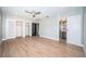 Spacious main bedroom with hardwood flooring features a large walk-in closet and ensuite bathroom at 3165 Renatta Dr, Belleair Bluffs, FL 33770