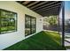 Beautiful outdoor patio with artificial grass and modern design at 3165 Renatta Dr, Belleair Bluffs, FL 33770
