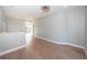 Bright, open area featuring wood flooring, recessed lighting, and access to a balcony with a view at 3165 Renatta Dr, Belleair Bluffs, FL 33770
