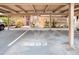 Carport area with assigned parking space, landscaping, and outdoor lighting at 3203 Doe Ct, Brandon, FL 33511