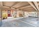 Assigned carport parking with well maintained landscapes, front door, and outdoor lighting at 3203 Doe Ct, Brandon, FL 33511
