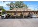 Cozy multi-Gathering home exterior showcasing assigned carport parking and well-maintained landscaping at 3203 Doe Ct, Brandon, FL 33511