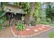 Charming home with lush landscaping, mature tree, and inviting walkway at 3203 Doe Ct, Brandon, FL 33511