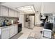 Well-lit kitchen with stainless steel appliances, mosaic backsplash, and granite countertops at 3203 Doe Ct, Brandon, FL 33511