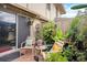 Cozy patio area featuring comfortable seating surrounded by lush greenery and charming decorations at 3203 Doe Ct, Brandon, FL 33511