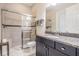 Elegant bathroom featuring a glass-enclosed shower and a vanity with granite countertops at 32242 Summerglade Dr, Wesley Chapel, FL 33545