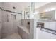 Modern bathroom featuring a glass-enclosed shower with a built-in bench and a spacious vanity area at 32242 Summerglade Dr, Wesley Chapel, FL 33545