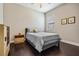 Bedroom showcases a queen bed, dark hardwood flooring, and neutral wall color scheme at 32242 Summerglade Dr, Wesley Chapel, FL 33545