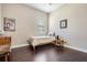 Cozy bedroom featuring a single bed, hardwood floors, and a bright window with natural light at 32242 Summerglade Dr, Wesley Chapel, FL 33545