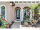 Charming entryway with manicured landscaping and an elegant front door at 32242 Summerglade Dr, Wesley Chapel, FL 33545