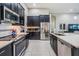 Well-equipped kitchen with stainless steel appliances and granite countertops at 32242 Summerglade Dr, Wesley Chapel, FL 33545