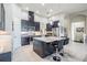 Spacious kitchen featuring dark cabinets, stainless appliances, and center island at 32242 Summerglade Dr, Wesley Chapel, FL 33545