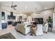 Bright living room and kitchen with tile flooring, modern appliances, and ceiling fans at 32242 Summerglade Dr, Wesley Chapel, FL 33545