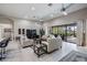 Bright and spacious living room with large windows and stylish furnishings at 32242 Summerglade Dr, Wesley Chapel, FL 33545
