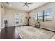 Bright living room with hardwood floors, large windows, and a view to the outside at 32242 Summerglade Dr, Wesley Chapel, FL 33545