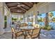 Relaxing poolside patio area offering cushioned chairs, tables, and shade under a pergola with views of community pool at 32242 Summerglade Dr, Wesley Chapel, FL 33545