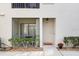 Charming condo entrance featuring a cozy screened patio and well-kept landscaping at 3366 Mermoor Dr # 1106, Palm Harbor, FL 34685