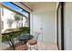 A cozy screened patio with outdoor furniture, offering a private outdoor living space at 3366 Mermoor Dr # 1106, Palm Harbor, FL 34685