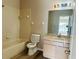 Bathroom with a shower-tub combo and vanity with ample storage space at 3531 High Hampton Cir, Tampa, FL 33610