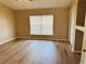 Bedroom with wood flooring, a ceiling fan and a large window at 3531 High Hampton Cir, Tampa, FL 33610