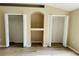 Bedroom with closets and a built-in shelving niche, perfect for storage and organization at 3531 High Hampton Cir, Tampa, FL 33610