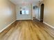 Open dining area with wood floors and archway to the kitchen at 3531 High Hampton Cir, Tampa, FL 33610