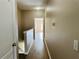 Bright hallway with wood-look floors leads to other rooms in the house at 3531 High Hampton Cir, Tampa, FL 33610