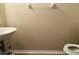 Clean powder room with a pedestal sink and modern fixtures at 3531 High Hampton Cir, Tampa, FL 33610
