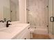This bathroom features a shower with white marble tile and a glass shower door at 36755 Thomas Jefferson Rd, Dade City, FL 33525