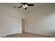 Bedroom featuring a ceiling fan and closet with folding doors at 36755 Thomas Jefferson Rd, Dade City, FL 33525