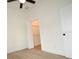 Bedroom featuring a ceiling fan and closet with folding doors at 36755 Thomas Jefferson Rd, Dade City, FL 33525