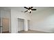 Spacious bedroom featuring a ceiling fan and closet at 36755 Thomas Jefferson Rd, Dade City, FL 33525