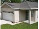 Charming single-story home featuring a one car garage and covered entryway at 36755 Thomas Jefferson Rd, Dade City, FL 33525