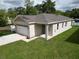 This charming single Gathering home features a well-manicured front yard, garage, and nice curb appeal at 36755 Thomas Jefferson Rd, Dade City, FL 33525