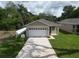 Charming single-story home featuring a one car garage and freshly painted driveway at 36755 Thomas Jefferson Rd, Dade City, FL 33525