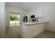 Kitchen with white cabinets, stainless steel appliances, and granite countertops at 36755 Thomas Jefferson Rd, Dade City, FL 33525