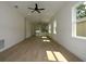 Bright and airy living room with wood-look floors and recessed lighting throughout at 36755 Thomas Jefferson Rd, Dade City, FL 33525