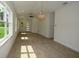 Open concept living space with hardwood floors, natural lighting, and neutral colors at 36755 Thomas Jefferson Rd, Dade City, FL 33525