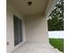 Covered patio with sliding glass door and view of the backyard at 36755 Thomas Jefferson Rd, Dade City, FL 33525