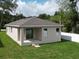 The home features a covered patio and sliding glass doors leading to the backyard space at 36755 Thomas Jefferson Rd, Dade City, FL 33525