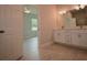 Bathroom features double vanity, stylish lighting and ceramic tile at 36777 Thomas Jefferson Rd, Dade City, FL 33525